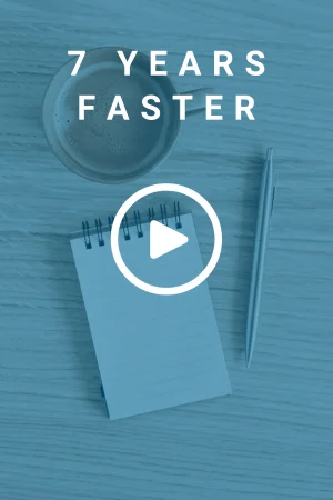 Aerial view of a cup of coffee, a pen, and an open notepad all placed on a wooden desk. There is a text overlay that reads '7 Years Faster'.
