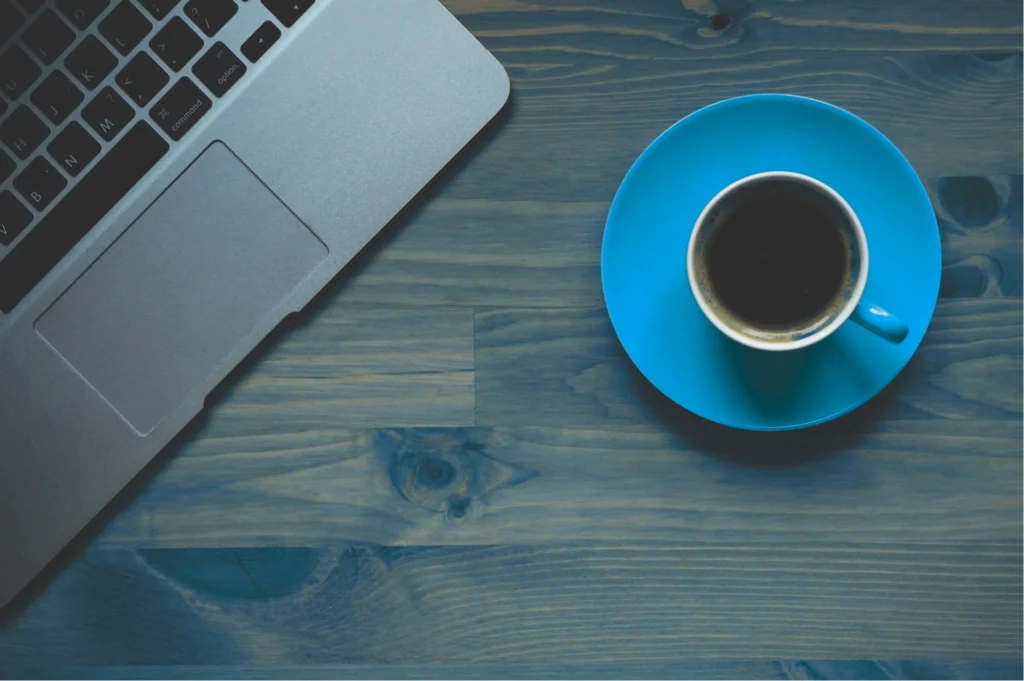 Blue Coffee Cup and Laptop