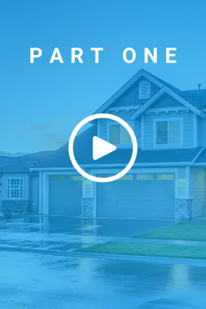 A curbside view of a suburban, two-story house with a green lawn and a 3-car garage. There is a text overlay that reads 'Part One'.