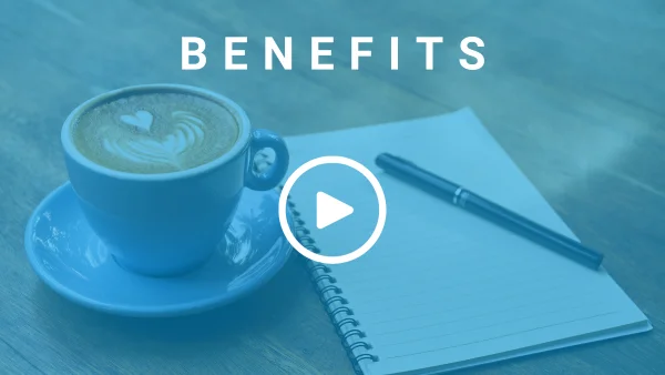A cup of coffee, a pen, and an open notepad all placed on a wooden desk. There is a text overlay that reads 'Benefits'.